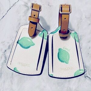 COACH pair of luggage tags with limes- leather strap